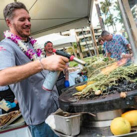 Chef Spike Mendelsohn cooking over an open flame