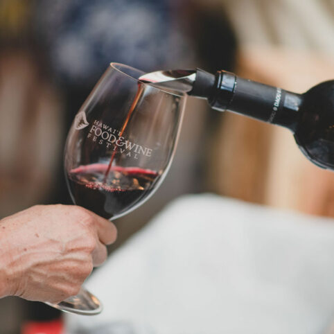 Pouring red wine into a Hawaii Food & Wine Festival Wine Glass